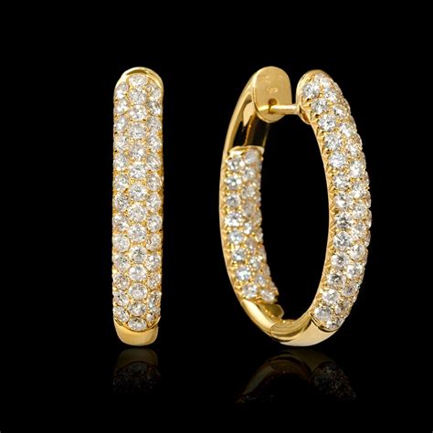 18k chanel hoop earrings|Earrings in gold and diamond .